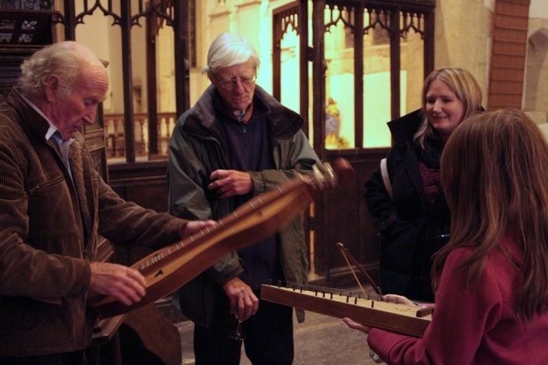 Guest storyteller Peter Hearn demonstrates some of his unusual instruments to the audience after the winter concert 2011.